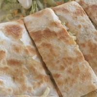 Quesadilla · Grilled flour tortilla filled with cheese and your meat choice, with lettuce and sour cream ...