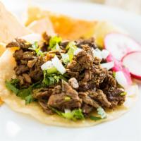 Taquitos · Meat, onions y cilantro on a corn tortilla.  (street style taco).