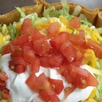 Taco Salad · Crisp flour tortilla shell filled with your meat choice and lettuce, topped with cheese, sou...