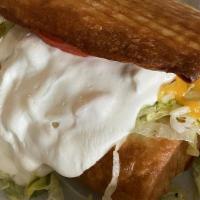Chimichanga · What's good. Flour tortilla filled with beans and your meat choice, deep fried and topped wi...