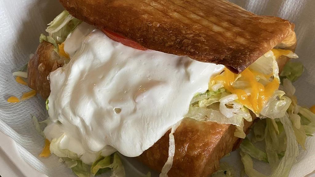 Chimichanga · What's good. Flour tortilla filled with beans and your meat choice, deep fried and topped with lettuce, cheese, sour cream, and tomato.