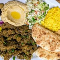 Beef Shawarma plate · Boneless Beef meat pot roasted  with spices. Served with Hummus, Israeli salad, Pickles, cho...