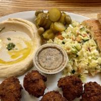 Falafel  (V) Plate · 5 Falafel balls made with Garbanzo beans, Garlic, Parsley, Cilantro, and Spices. Served with...