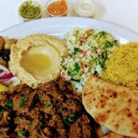 Lamb Shawarma Plate · Lamb  pot roasted with spices and served with Salad and Pita/ rice.