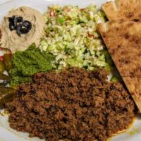 Ground Beef Plate · Ground beef cooked with tomatoes, spices, and herbs. Served with Hummus, Israeli salad, Pick...