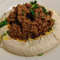 Hummus Ground Chicken · Hummus topped with ground natural Chicken cooked with Onions, Tomatoes, Garlic, Peppers, spi...