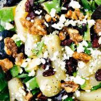 Pear Walnut Salad  · Mixed greens, Pear , Walnuts, Cranberries and Feta cheese.