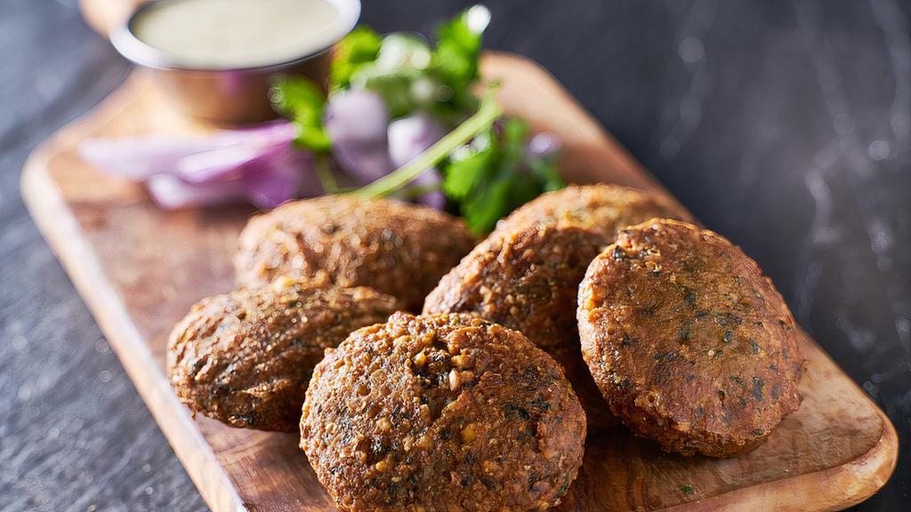 Falafel (6 pcs) · Fried chickpea mix with onion garlic parsley and a touch of tahini sauce.