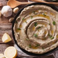 Baba Ghanoush  · Chopped garlic, roasted eggplant dip with olive oil.