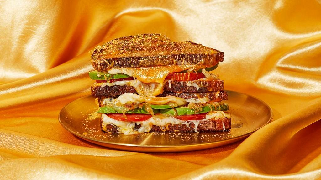 Oh So Fancy Grilled Cheese · Fancy it up a notch with melty gooey cheddar and mozzarella cheese with grilled onions, sliced tomato, and avocado on griddled bread.