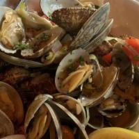 Steamed Clams · Wild-caught Clams, Chardonnay, Garlic, Shallots, Leeks, Fennel and Scallions in Lemon Butter...