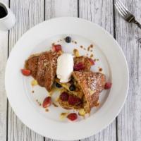 Croissant French Toast · Vegetarian. Fresh baked butter croissant soaked in eggs and milk, cooked until golden brown ...