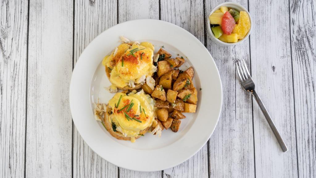 Jumbo Crab Bene · Fresh crab meat, sauteed spinach and poached eggs stacked on a lightly toasted English muffin with our scratch made Hollandaise sauce and served with house potatoes or a cup of fruit.