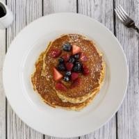 Buttermilk Pancakes · Vegetarian. Two scratch-made buttermilk pancakes topped with berries, fresh whipped butter, ...