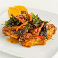 Angel Wings · Fried chicken wings tossed in sweet & spicy garlic sauce topped with fried basil