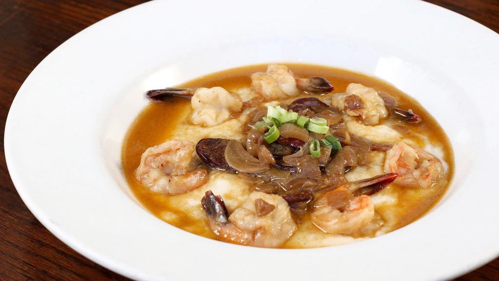Spicy Shrimp & Grits · Wild louisiana shrimp, garlic, shallots, and andouille sausage red eye gravy.