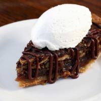 Bourbon Pecan Pie · Housemade pecan pie with chocolate sauce and whipped cream....