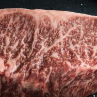 Wagyu New York Strip · (20oz.) . Packaged for cooking at home.