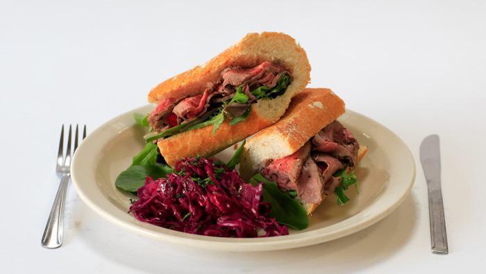 Pepper Tri-Tip of Beef Sandwich · In red wine sauce.
Cabbage on the side