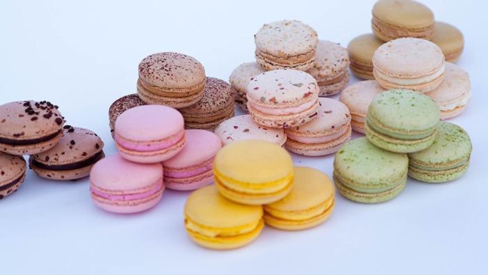 Large French Macaron · Almond based egg white cookies, assorted traditional flavors include pistachio, raspberry, mango passion fruit, chocolate, and coffee.