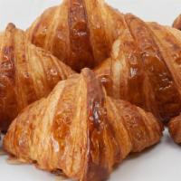 Croissant · Buttery flasky pastry in a crescent shape.