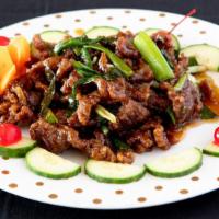 Wok Seared Scallion Beef Filet · Tender slices of beef seared to perfection with green scallions.