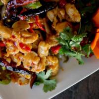 Firecracker Chicken · Hot and spicy. A festive dish with chicken breast sautéed with red and green peppers in a sp...