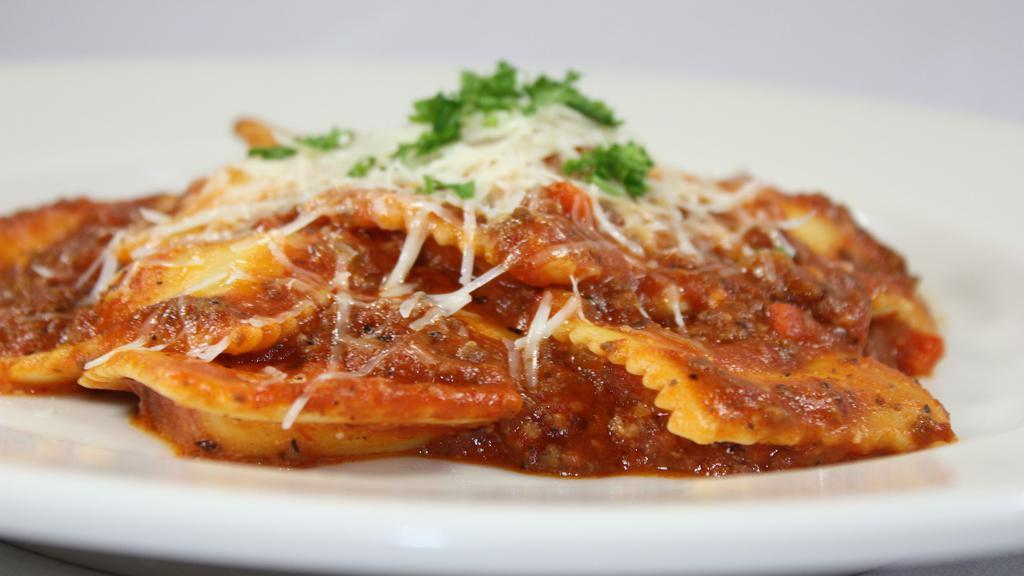 Ravioli Bolognese · Home made meat sauce tossed w/ cheese ravioli.