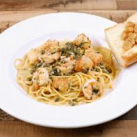 Scampi · Shrimp, scallops, garlic, capers in white wine lemon sauce w/ spaghetti.