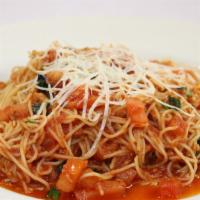 Pomodoro · Fresh tomato, fresh basil, garlic, topped with shredded parmigiano cheese w/ angel hair pasta.