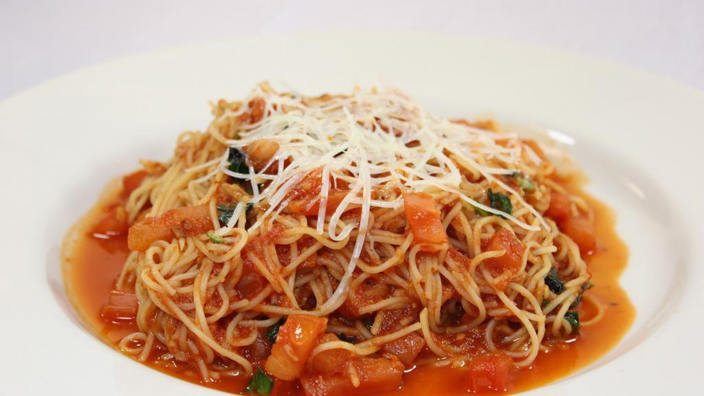 Pomodoro · Fresh tomato, fresh basil, garlic, topped with shredded parmigiano cheese w/ angel hair pasta.