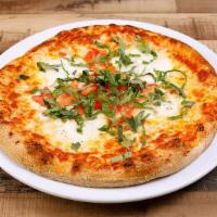Caprese pizza · Mozzarella & cheddar cheese, tomato sauce topped with fresh mozzarella, fresh tomato & basil.