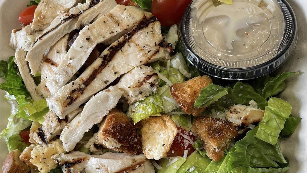 Chicken Caesar Supreme · Romaine lettuce tossed in garlicky caesar dressing, garlic-citrus chicken filet, cherry tomatoes, avocado, fresh grated parmesan cheese and croutons.