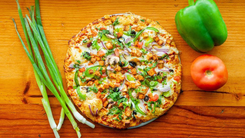 16. Shahi Paneer · Creamy shahi sauce, cheese, bell peppers, red onion, diced tomatoes, masala paneer, black olives, green onion, cilantro.
