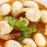 Tom Yum Goong (Shrimp Spicy Sour Soup) · Thai tradition spicy and sour shrimp soup with Thai herbal lemon glass, galangal kaffir lime...