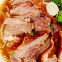 Kuay Teow Ped (Duck Noodle Soup) · Fresh rice noodle in special duck soup with roasted duck,bean sprout and Chinese broccoli.