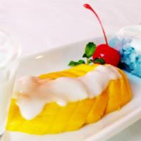 Mango Sticky An Chan Rice (seasonal) · Traditional Thai styled steamed sticky jasmine rice with An Chan hearb served with Thai Mang...