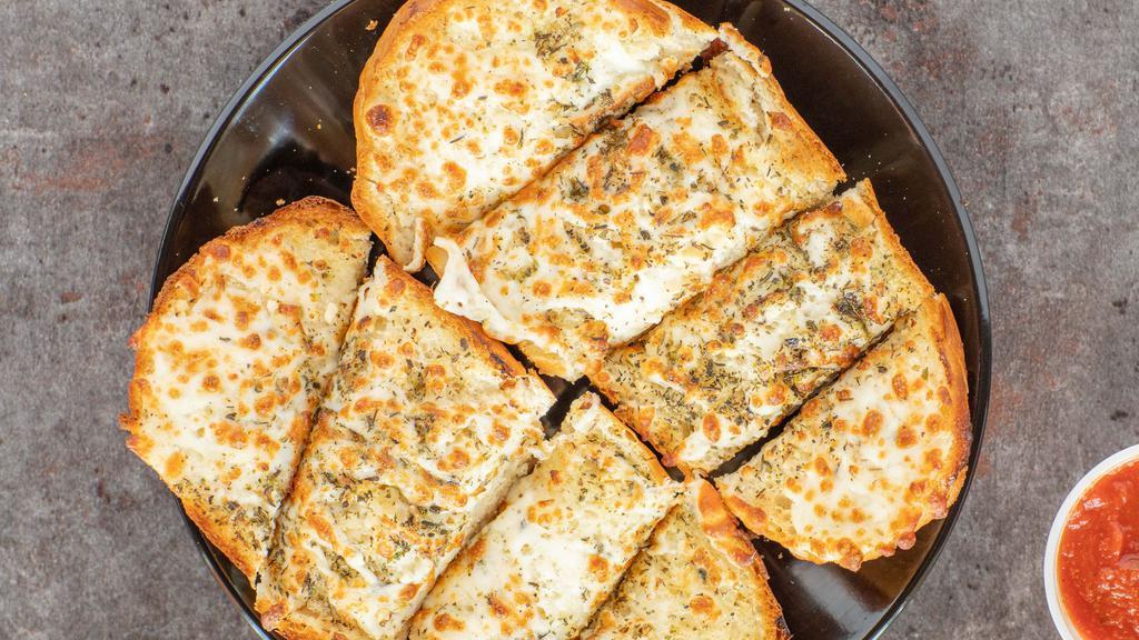 Garlic Cheese Bread · Oven baked bread on a hot french roll with garlic spread and cheese.
