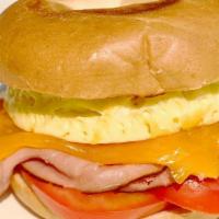 #2 Breakfast Melt · Scrambled eggs, choice of ham, bacon or turkey. Herbs, cheese, and tomato on your choice of ...