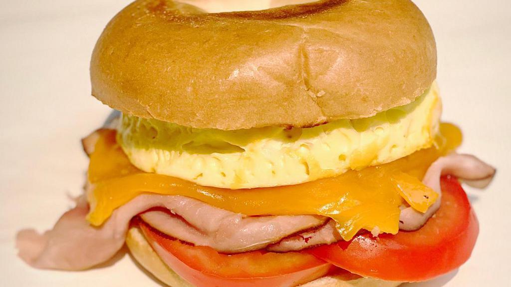 #2 Breakfast Melt · Scrambled eggs, choice of ham, bacon or turkey. Herbs, cheese, and tomato on your choice of bagel, toast, English muffin, or croissant