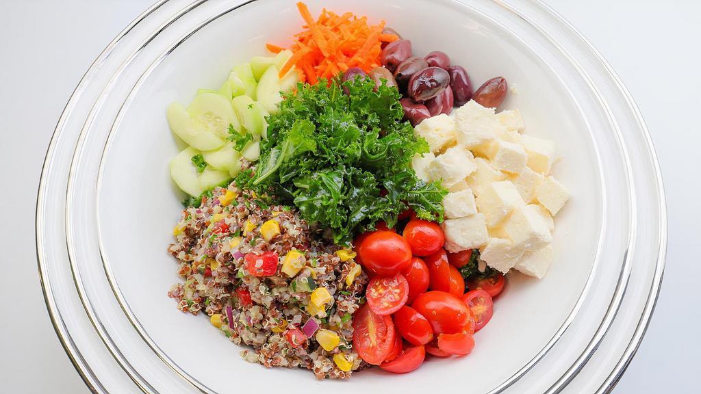 Lemon Garlic Kale & Quinoa Salad · Organic Kale, Homemade Savory Quinoa, Feta Cheese, Kalamata Olives, Cucumbers, Tomatoes, Shredded Carrots Tossed in Our Lemon Roasted Garlic Herb Dressing. Served with French Bread. Our quinoa is mixed with red bell pepper, cucumber, corn, and parsley.