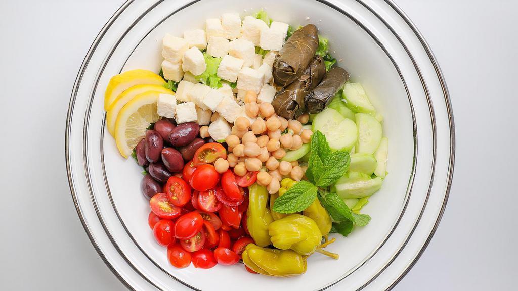 Greek Salad · Mixed Lettuce, Tomato, Cucumber, Red Onion, Pepperoncini, Kalamata Olives, Feta Cheese, Olive Oil, Lemon Juice and Spices. Served with French Bread