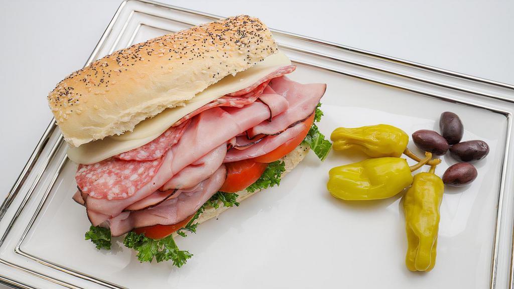 Italian Sub · With Ham, Italian Salami, Provolone, Pepperoncini, Olive Oil & Balsamic Vinegar, Lettuce, Tomato, Red Onions on a Toasted Ciabatta Roll