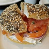 Smoked Salmon on a Bagel · With cream cheese, sprouts, cucumbers, tomatoes, red onion and capers. Add bacon inside for ...