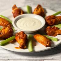 Buffalo Wings · 8 piece chicken wings, celery with choice of spicy or sweet glaze.