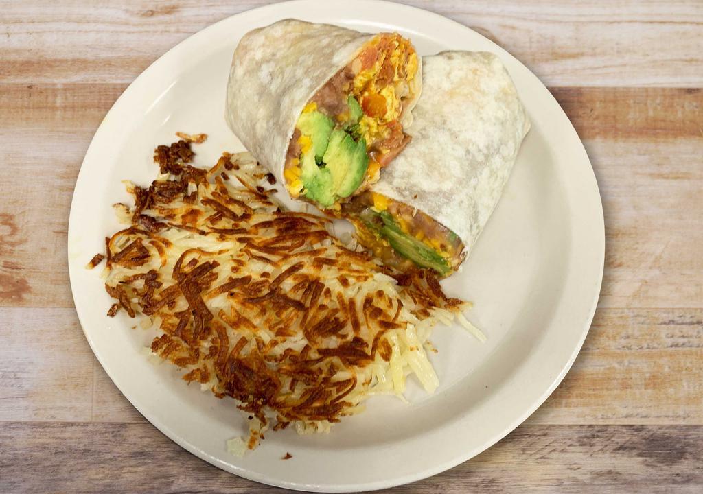 Breakfast Burrito · Flour tortilla, scrambled eggs, chorizo, avocado, tomatoes, refried beans, jack and cheddar cheese, hash browns.