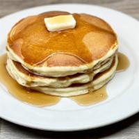 Full Stack · Three buttermilk pancakes.