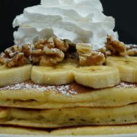 Banana Walnut Pancakes · Three buttermilk pancakes, banana, walnut, powdered sugar, whipped cream.