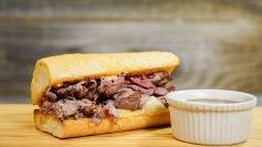 French Dip  · Thinly sliced roast beef, house spread, swiss cheese and all natural Au Jus, Served hot.