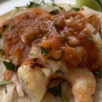 Regular Taco · Choice of meat, cilantro, onion, and salsa.